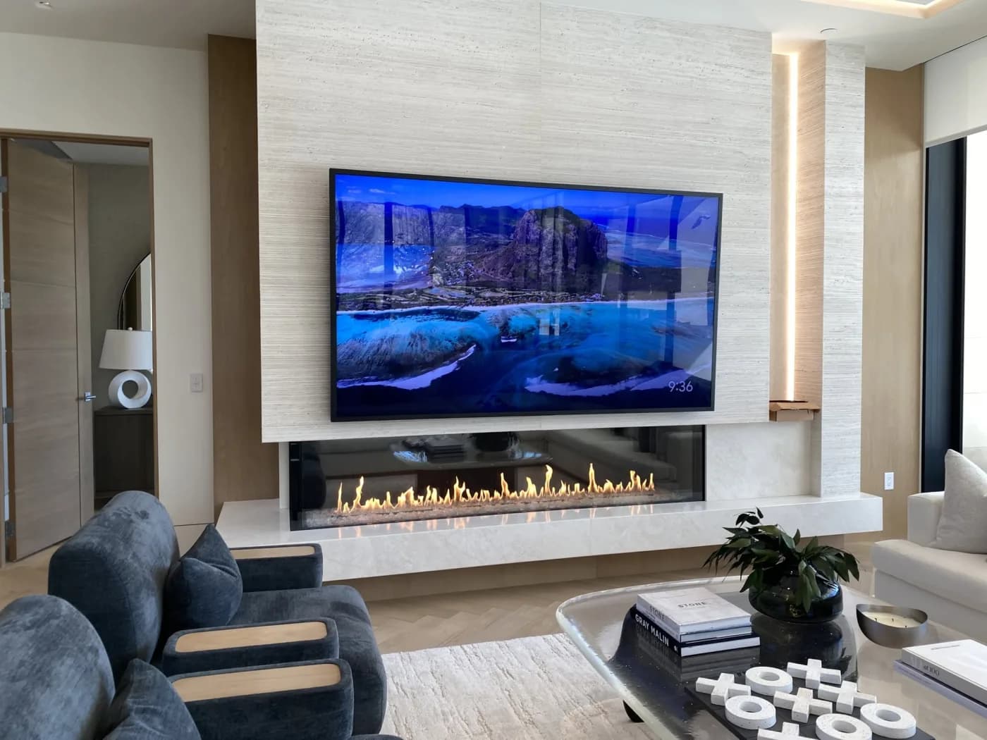 Luxury linear fireplace beneath a wall-mounted TV in a modern Las Vegas home