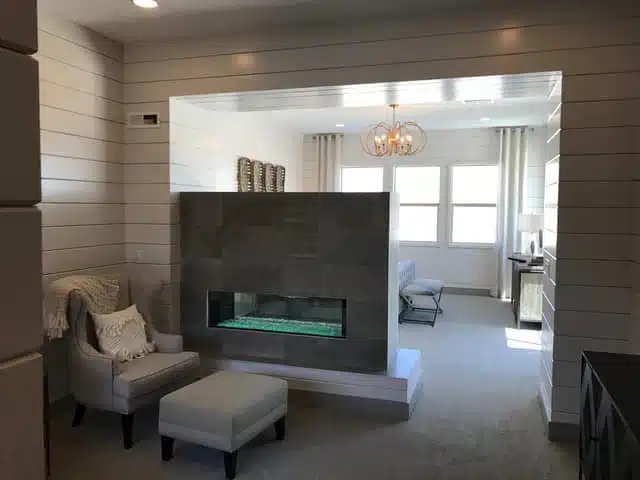 Cozy modern living space with a double-sided fireplace